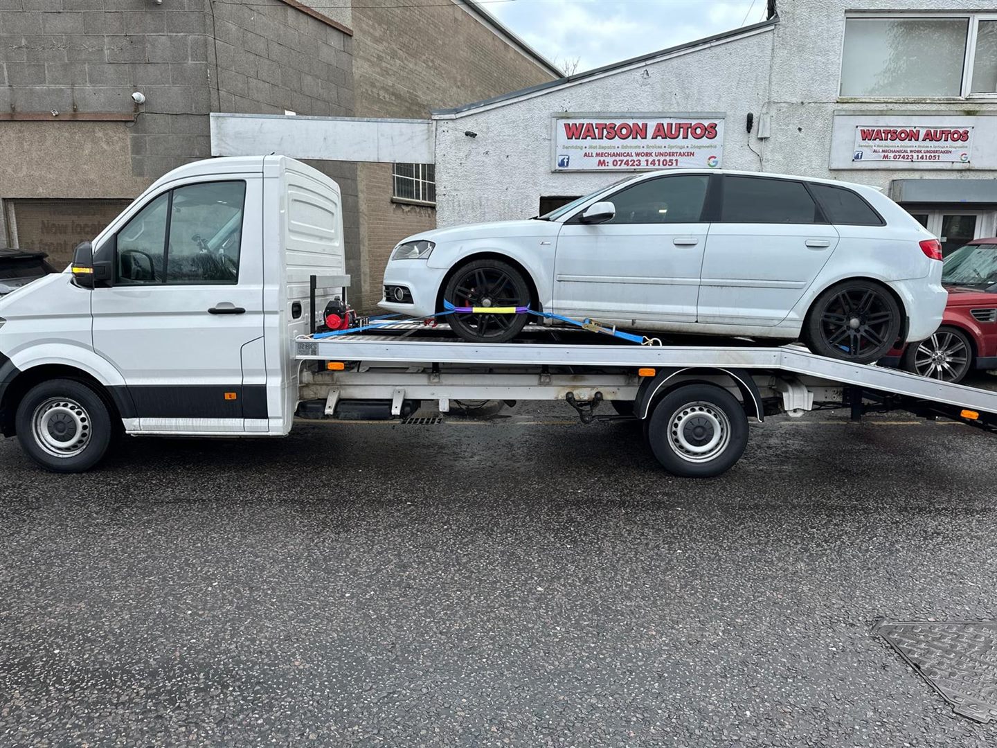 ZRG truck carrying a white car